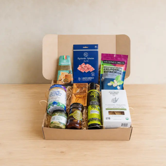 RaizBack premium gourmet gift box with jamón ibérico, California pistachios, organic olive oil, flaxseed crackers and artisanal foods