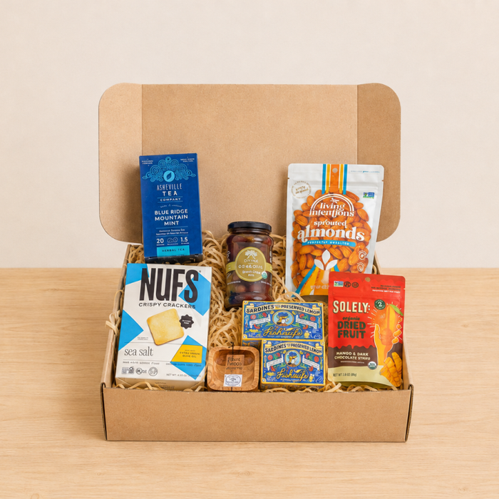 RaizBack gourmet gift box with sardines, sea salt crackers, sprouted almonds, dried fruit, olive tapenade and herbal tea