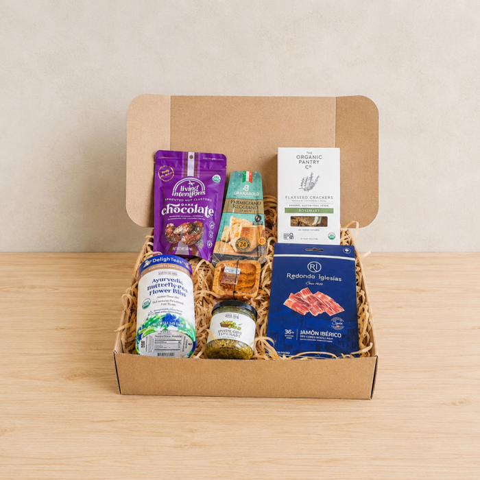 RaizBack gourmet gift box with jamón ibérico, Parmesan crisps, organic flaxseed crackers, chocolate, yogurt and olive tapenade