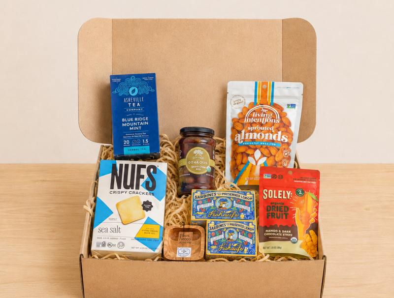 RaizBack gourmet gift box with sardines, sea salt crackers, sprouted almonds, dried fruit, olive tapenade and herbal tea